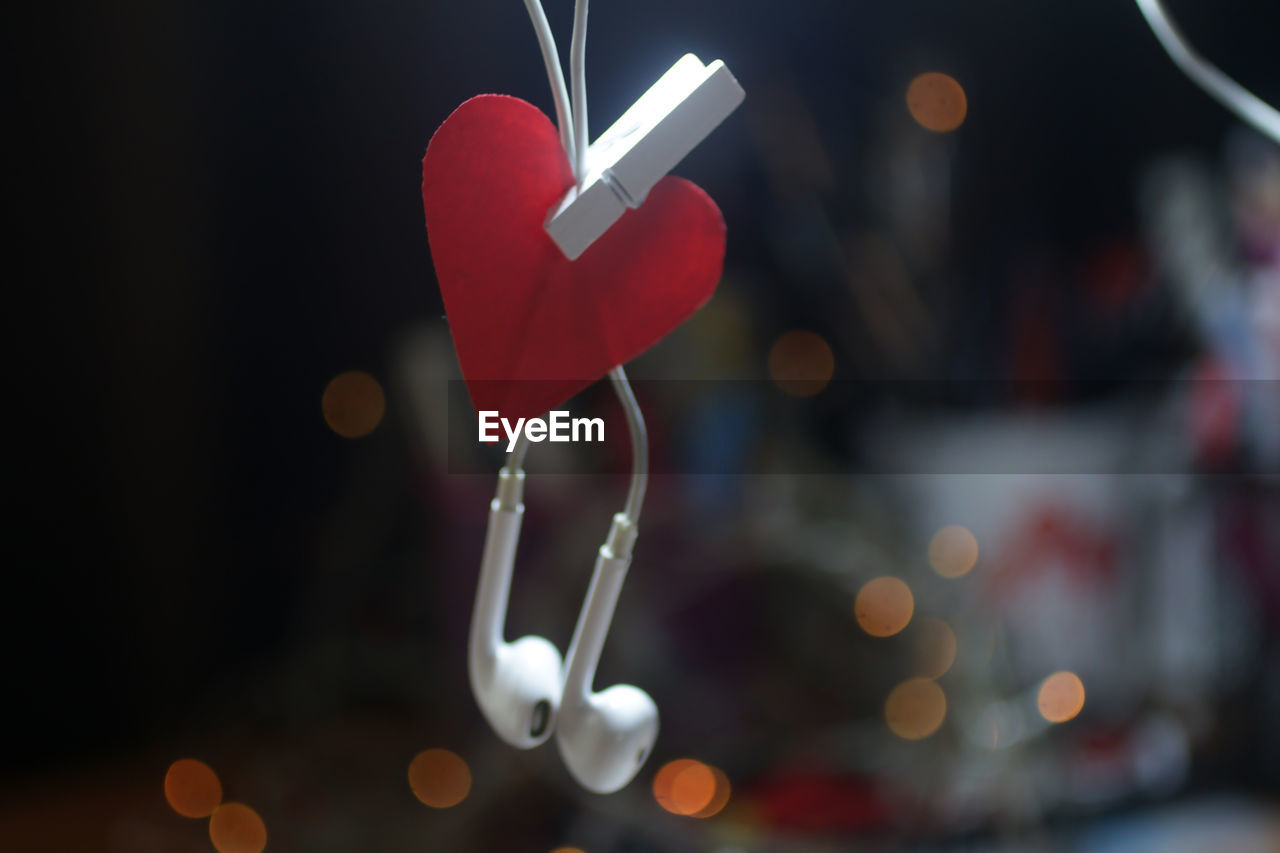 Close-up of heart shape with earphone decoration. 