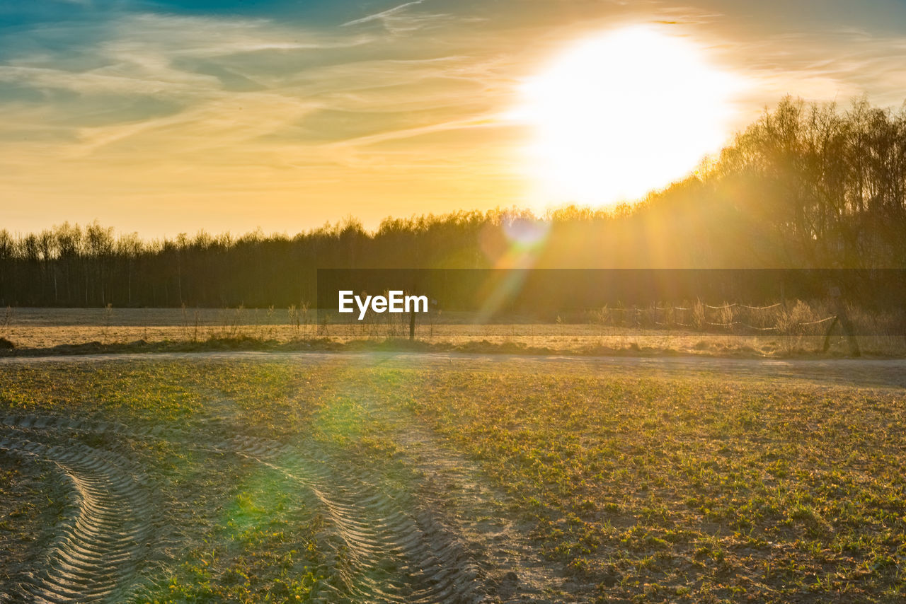 Scenic view of landscape against sky during sunset