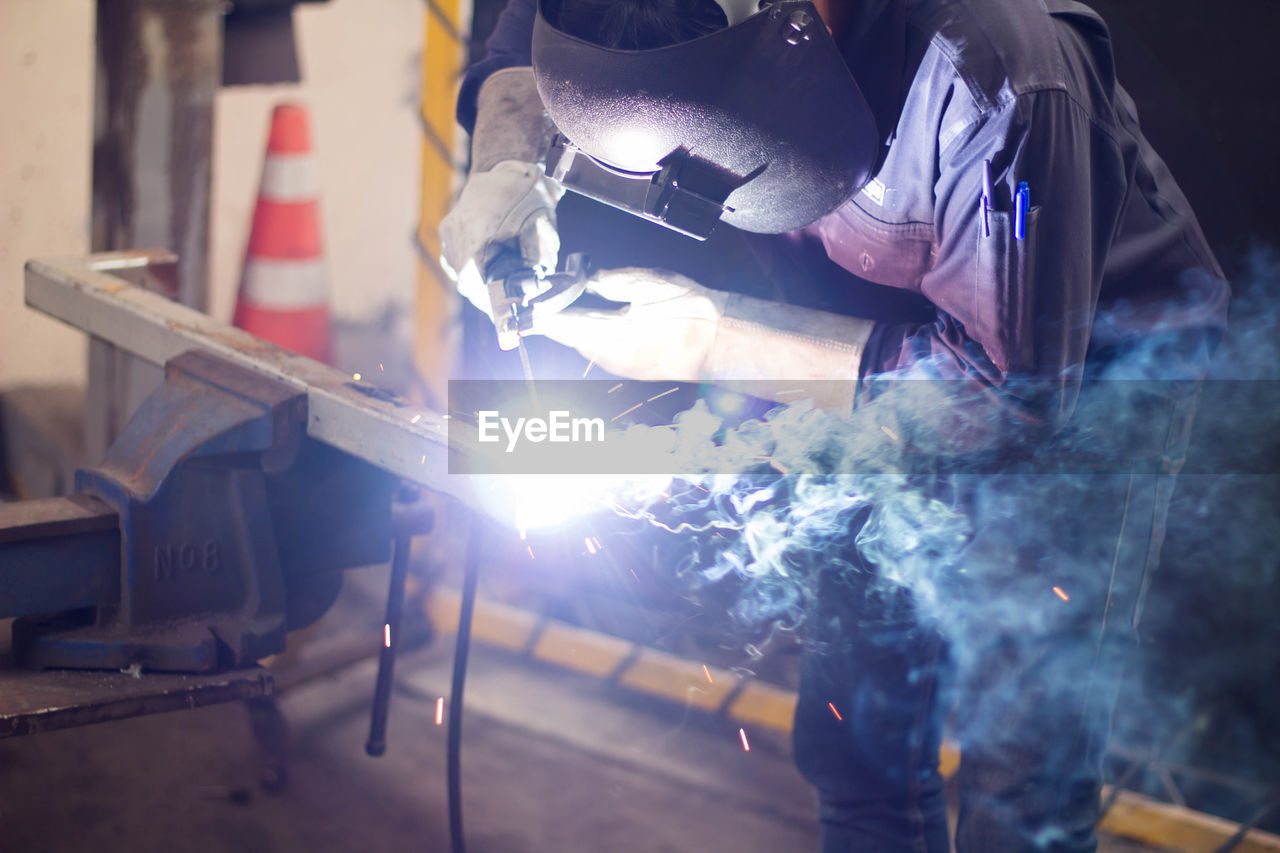 Man working on metal in workshop