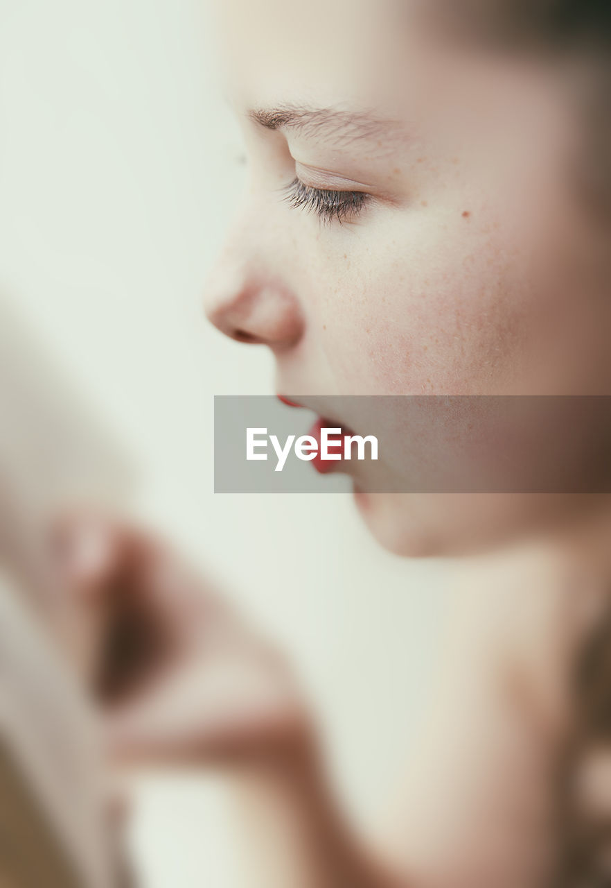 CLOSE-UP PORTRAIT OF A WOMAN WITH EYES