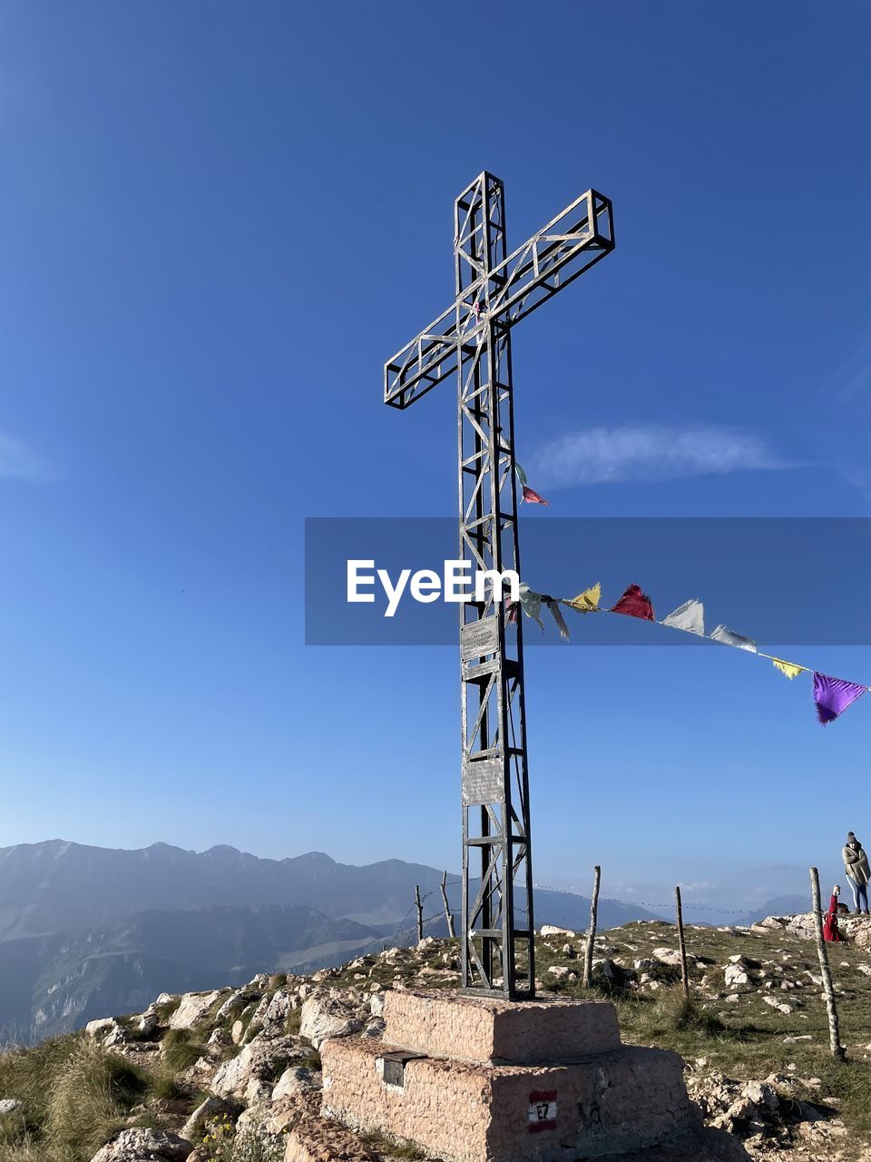 LOW ANGLE VIEW OF WINDMILL ON MOUNTAIN AGAINST CLEAR SKY