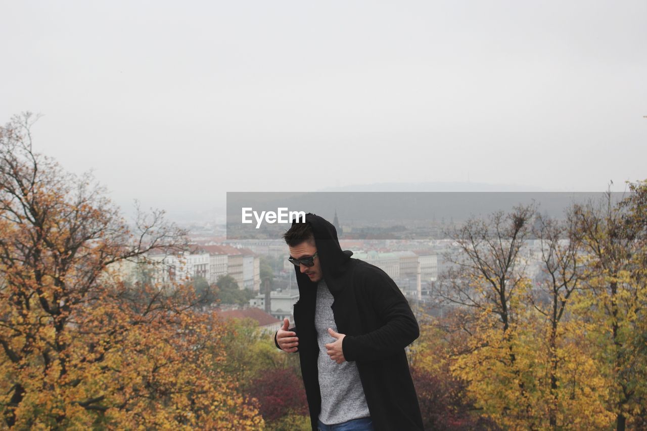 Man in sunglasses against clear sky