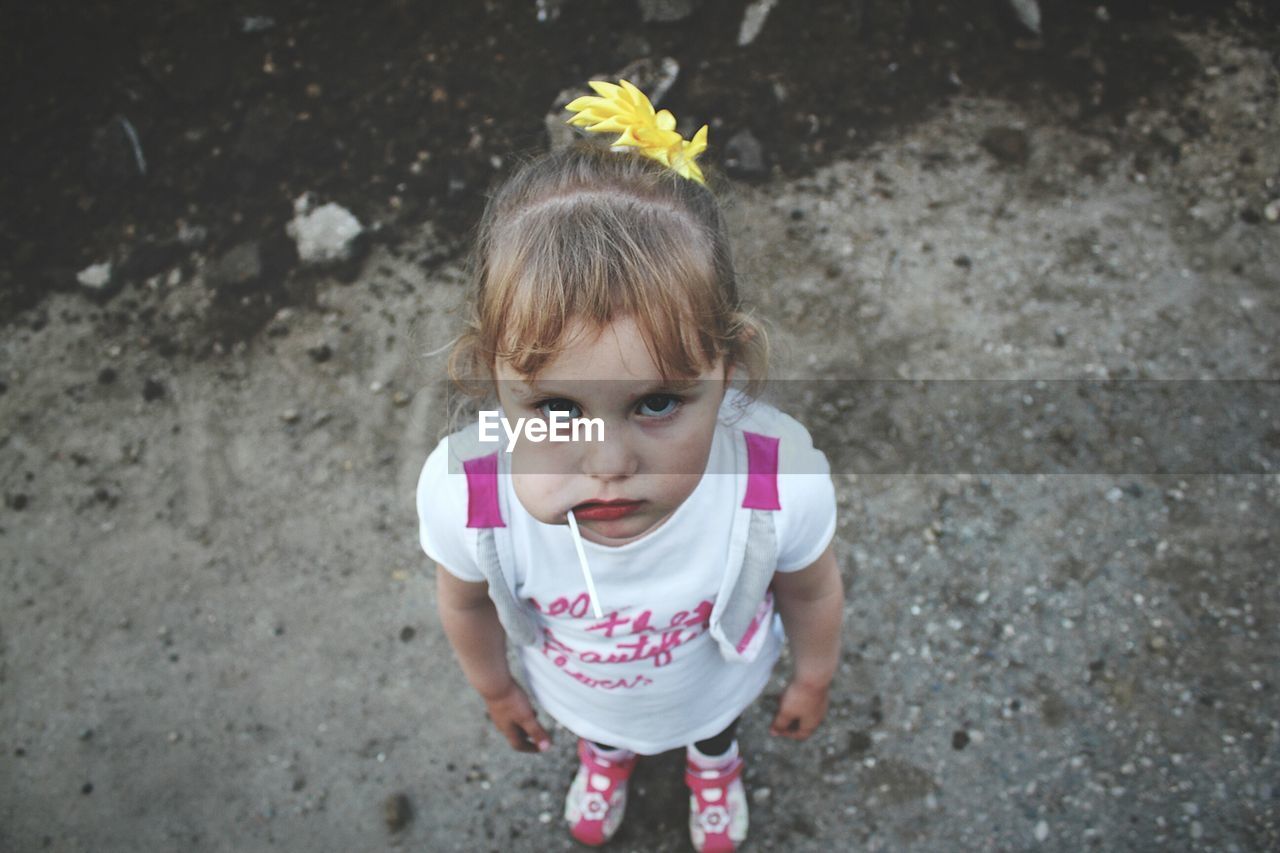 High angle portrait of cute girl with lollipop