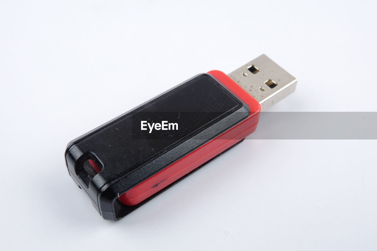 Close-up of usb stick over white background