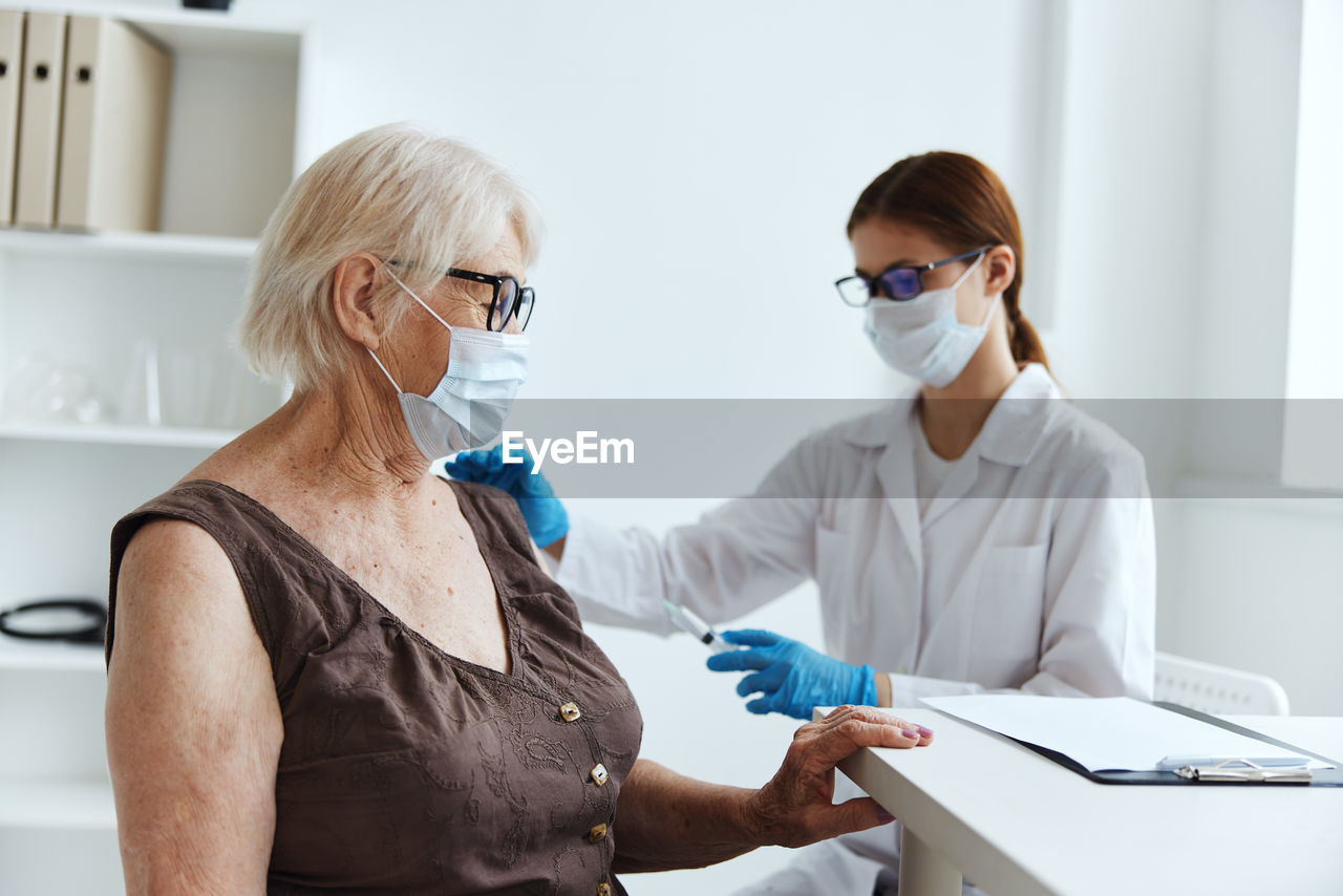 WOMAN WORKING IN A MIRROR