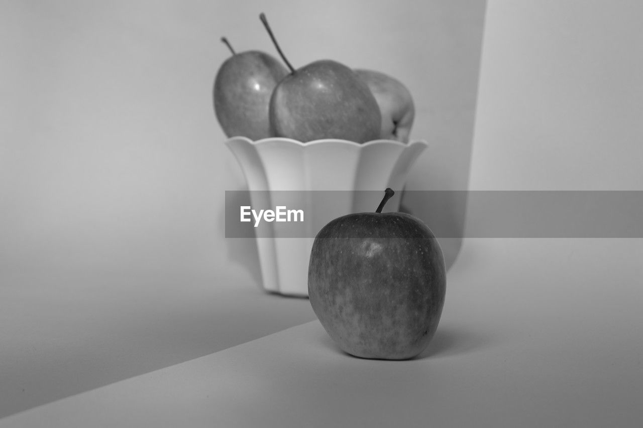 still life photography, healthy eating, food, white, food and drink, fruit, wellbeing, black and white, indoors, freshness, monochrome photography, no people, still life, studio shot, lighting, apple - fruit, monochrome, pear, black, table, gray background, close-up, plant, gray