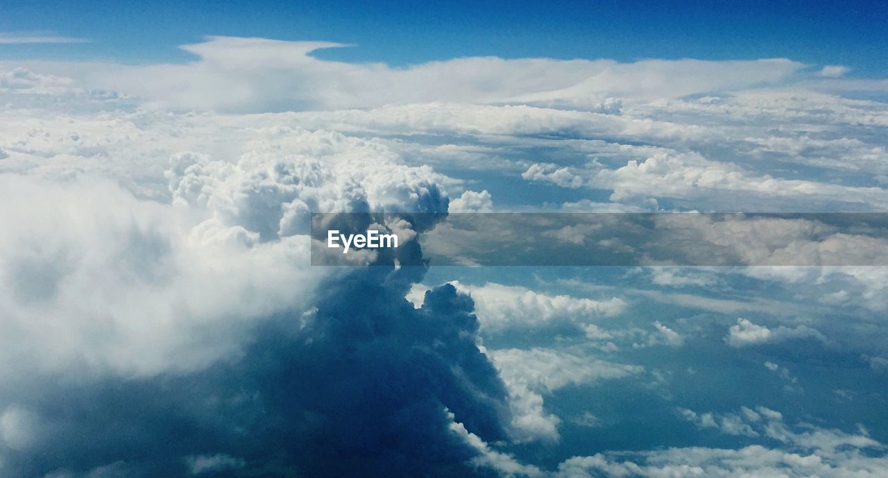 AERIAL VIEW OF CLOUDS AGAINST BLUE SKY