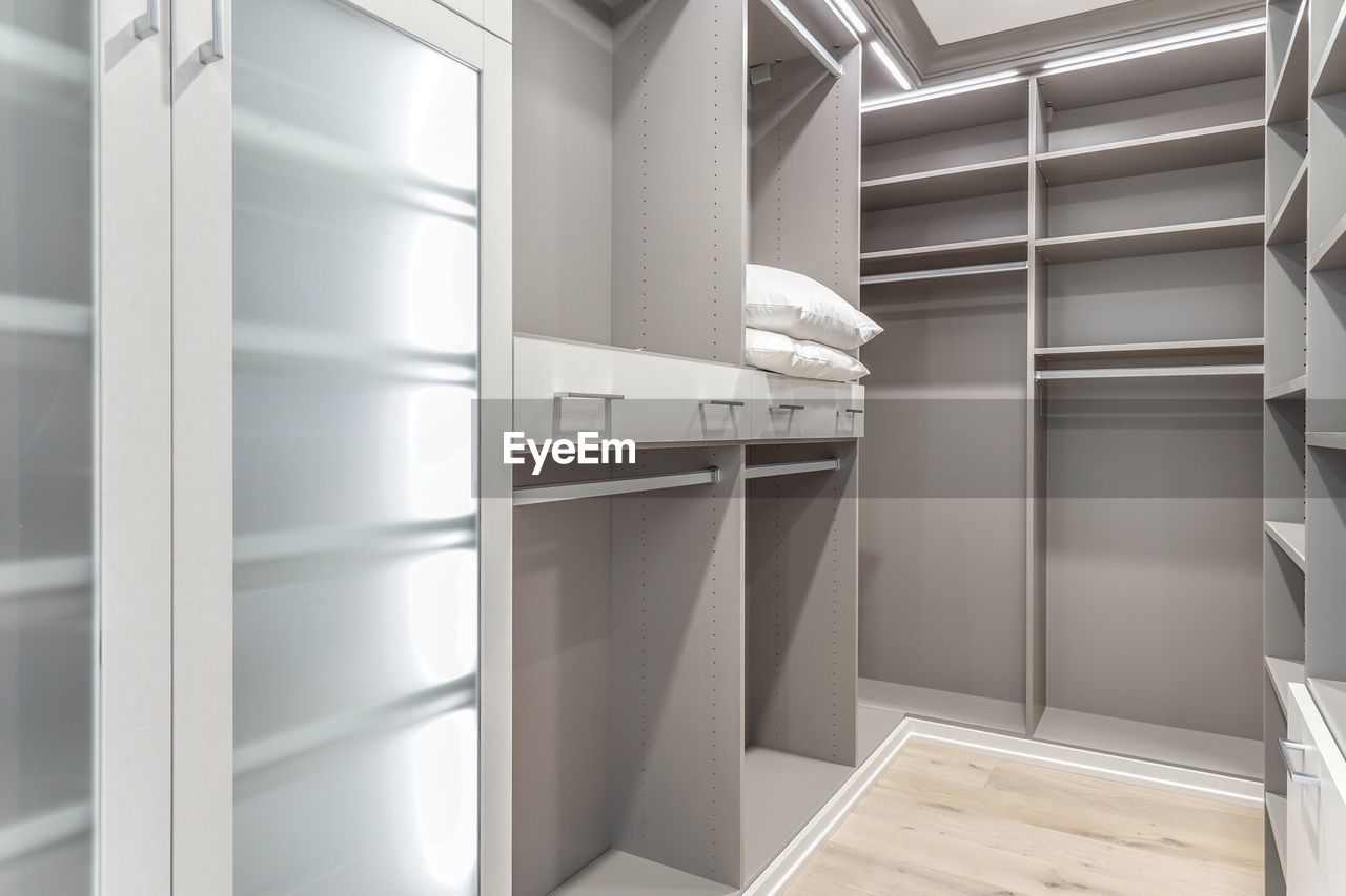 Gray shelves and drawers with doors