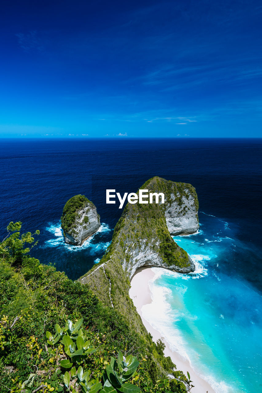 scenic view of sea against clear blue sky