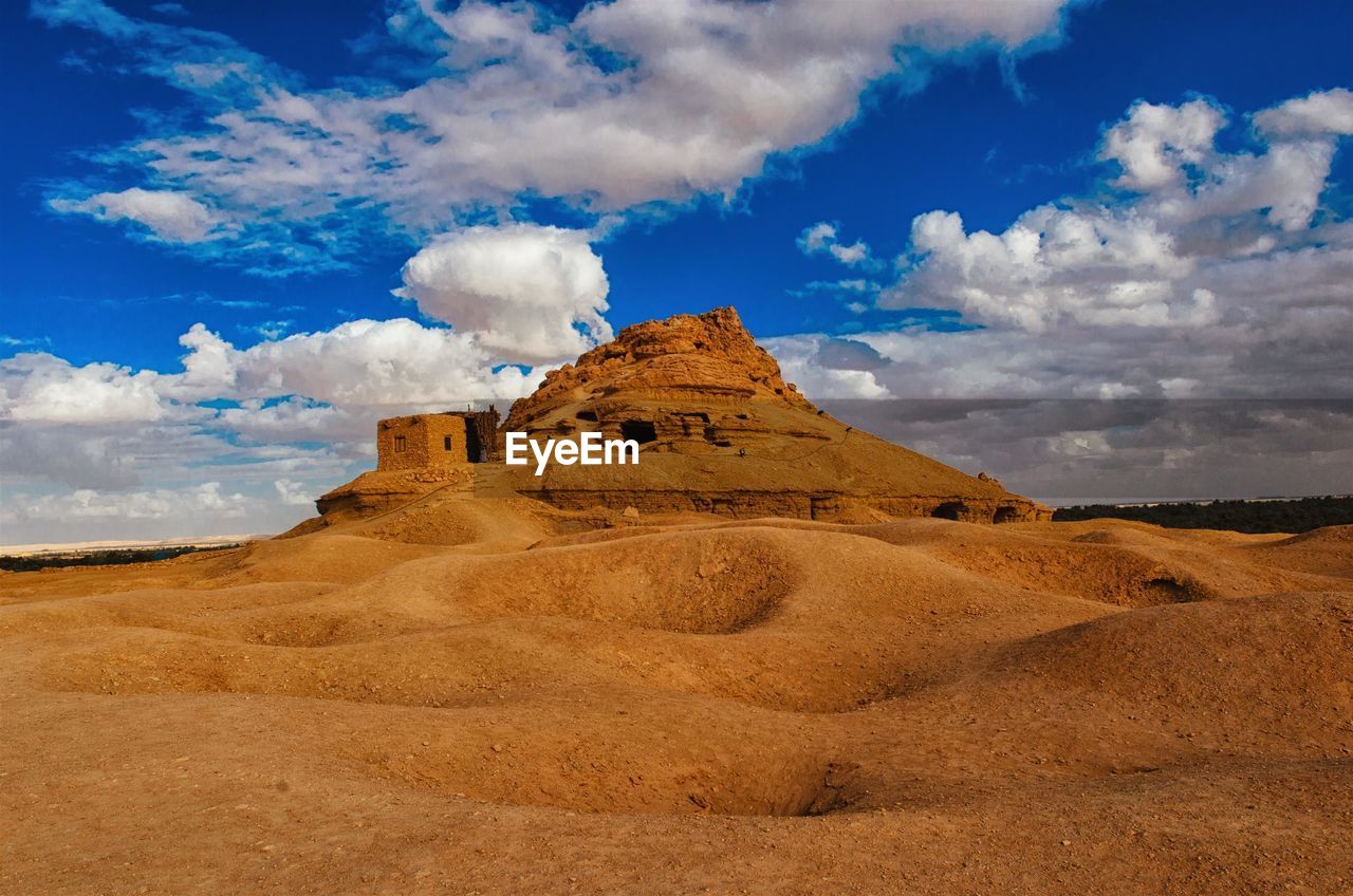 View of landscape against cloudy sky