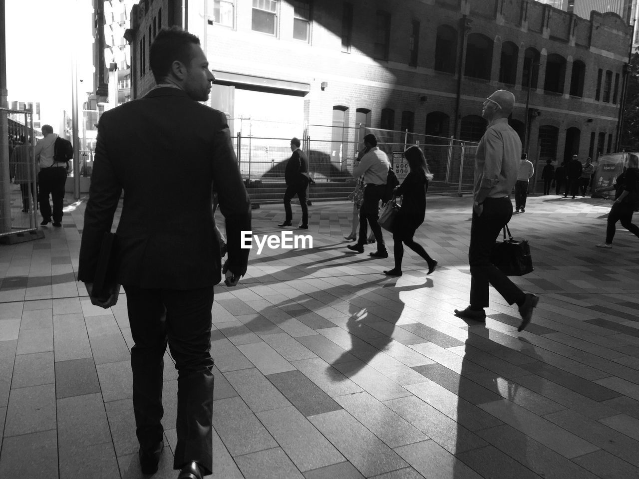 PEOPLE AT RAILROAD STATION PLATFORM