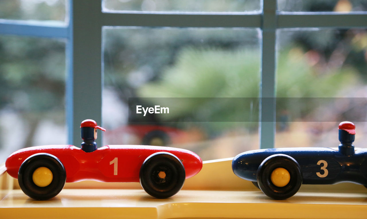Toy race car by the window