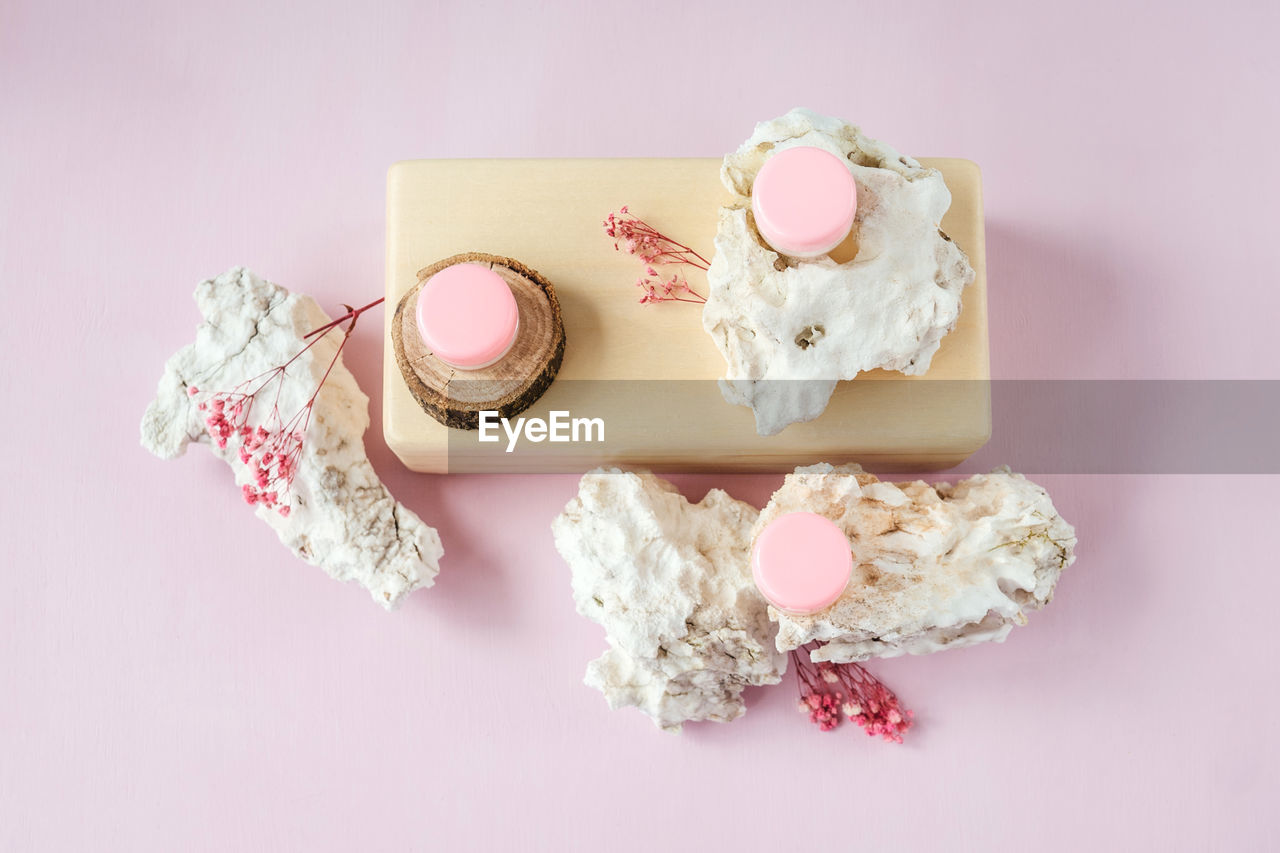 HIGH ANGLE VIEW OF ICE CREAM WITH PINK CAKE