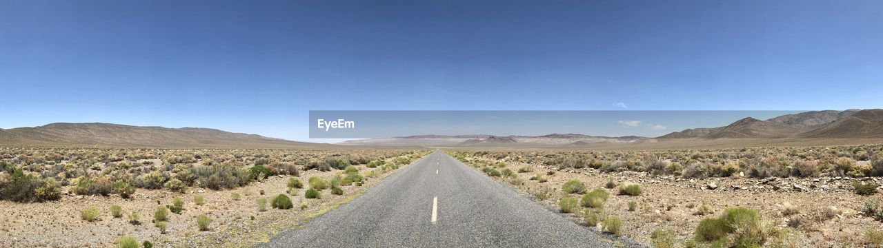 PANORAMIC VIEW OF ROAD AGAINST CLEAR SKY