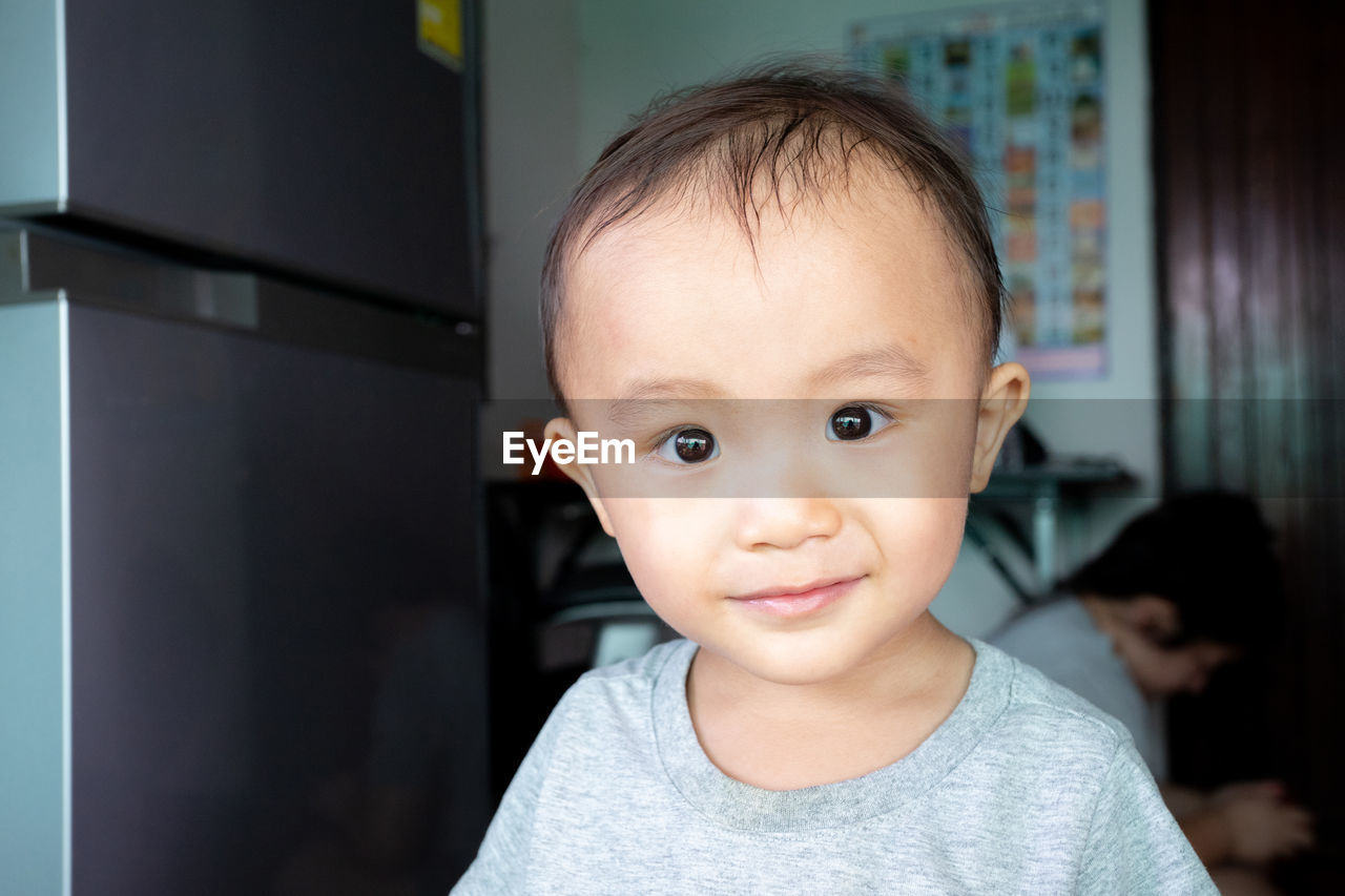 Portrait of cute baby boy at home