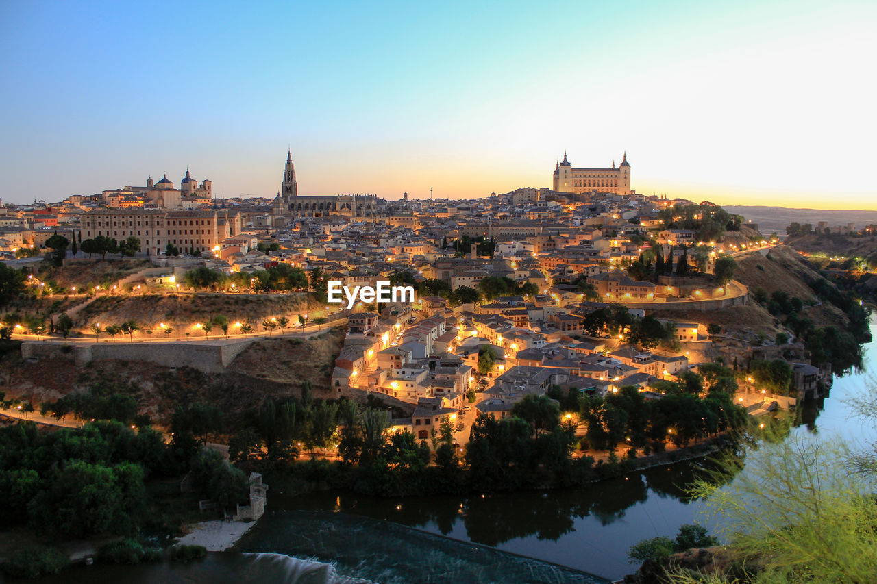 Alcazar fortress in illuminated city seen from mirador del valle