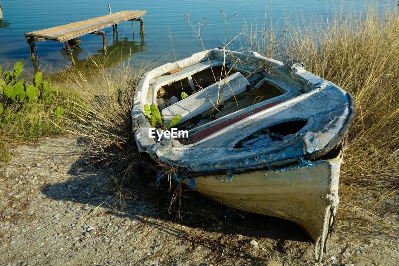 High angle view of abandoned boat moored on shore