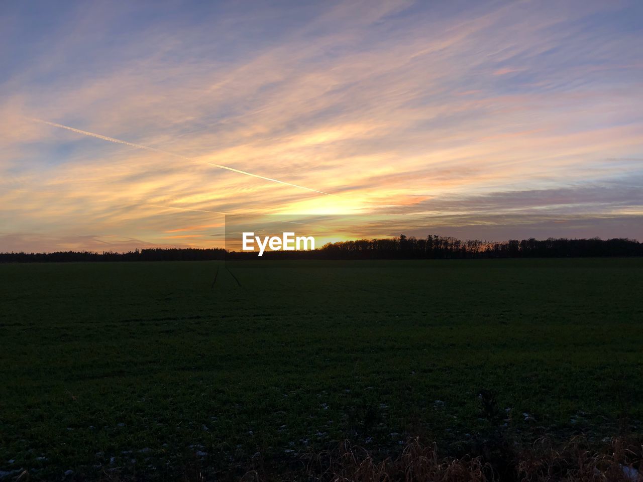 SCENIC VIEW OF LAND AGAINST SKY DURING SUNSET