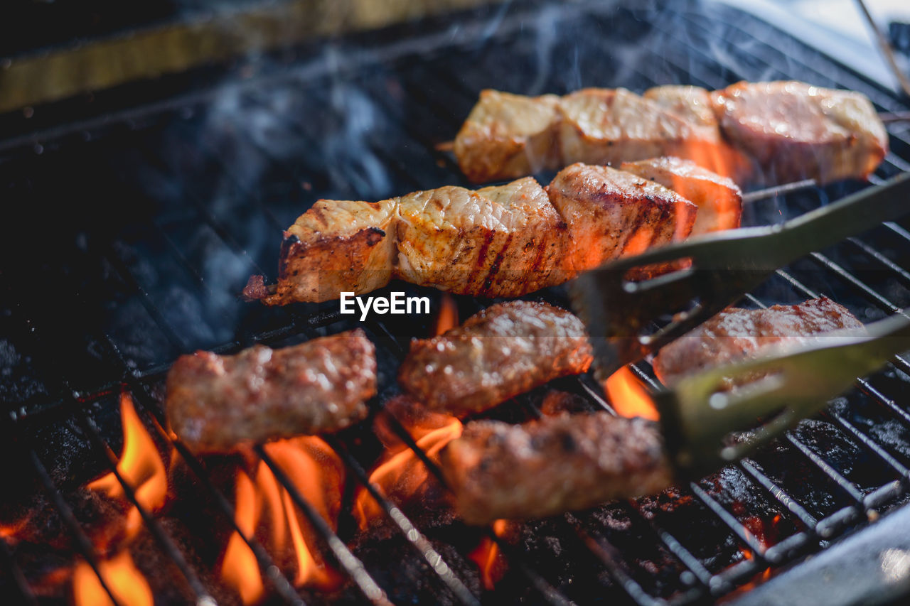 Close-up of meat on barbecue grill