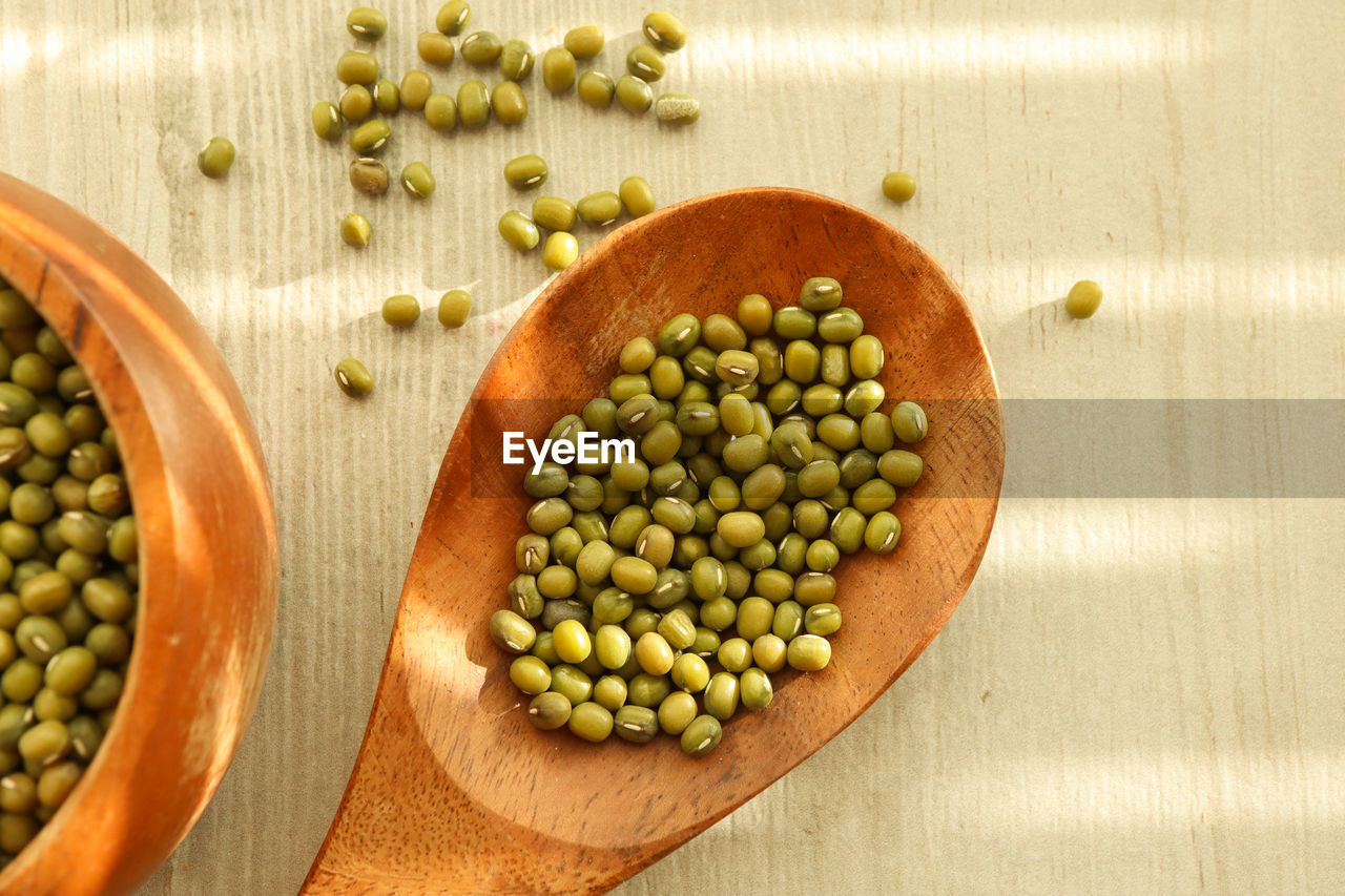 high angle view of green peas in bowl on table