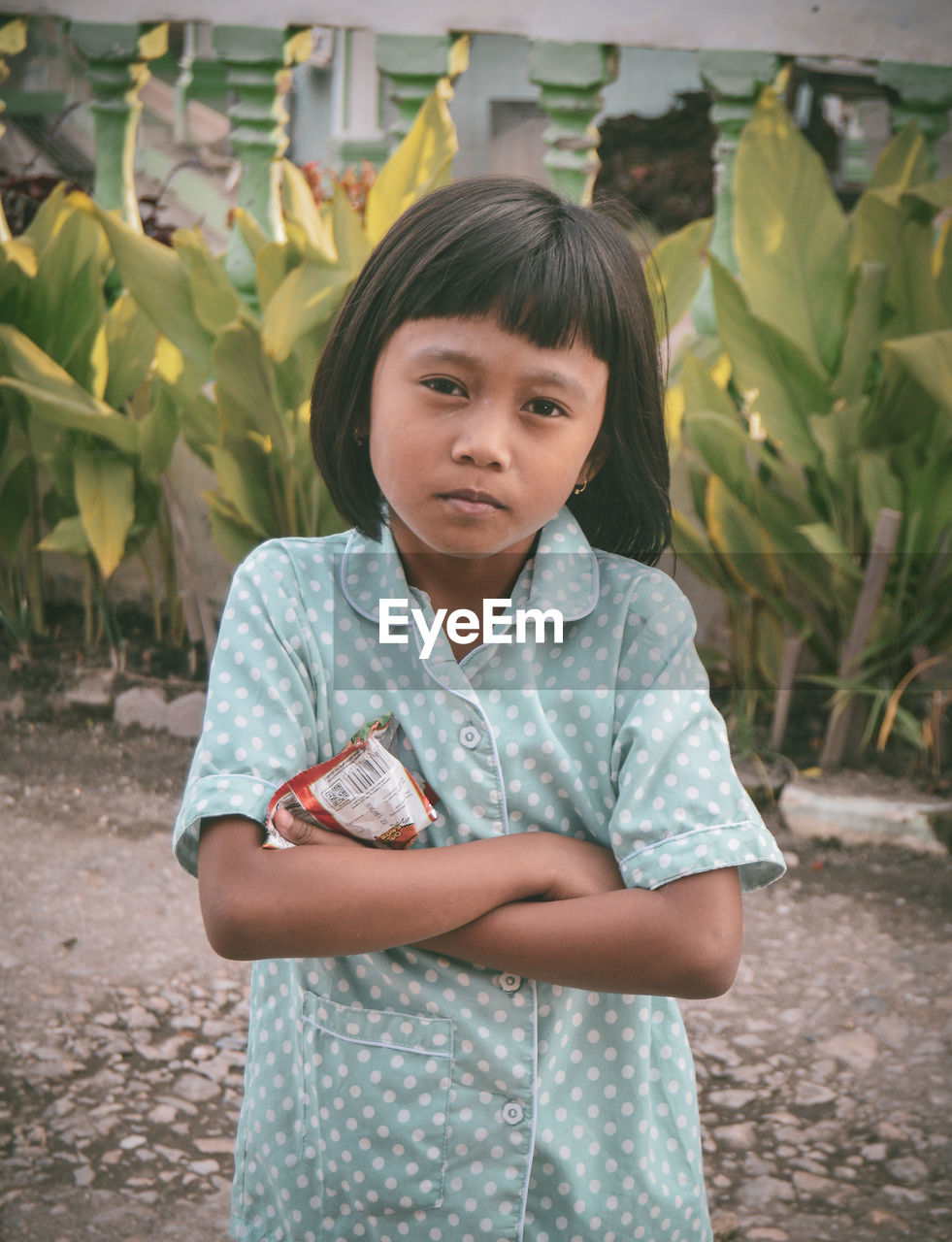 Portrait of girl standing outdoors