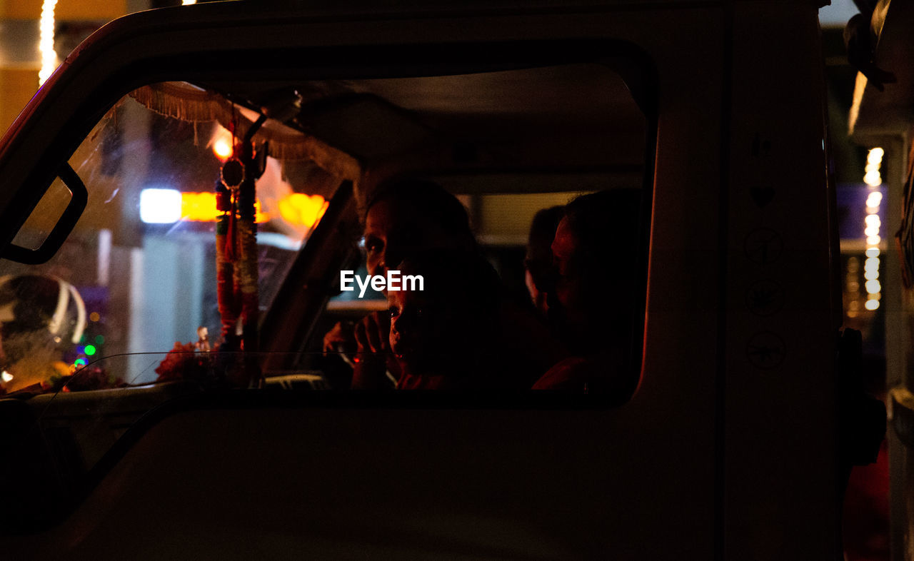 MEN SITTING IN CAR