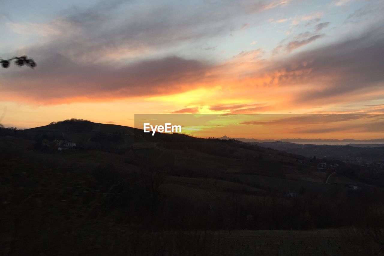 SILHOUETTE LANDSCAPE AGAINST SKY DURING SUNSET