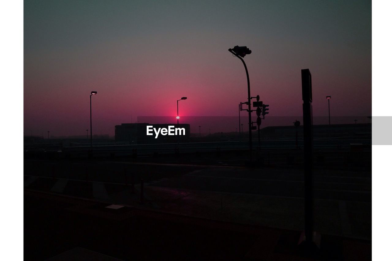 View of silhouette landscape against sunset