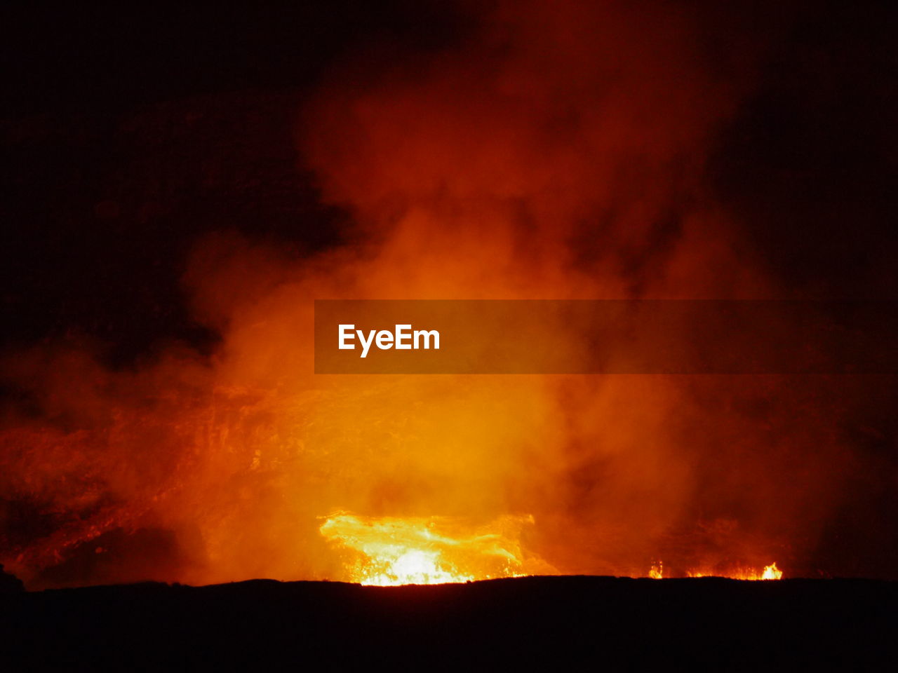 SCENIC VIEW OF BONFIRE ON MOUNTAIN