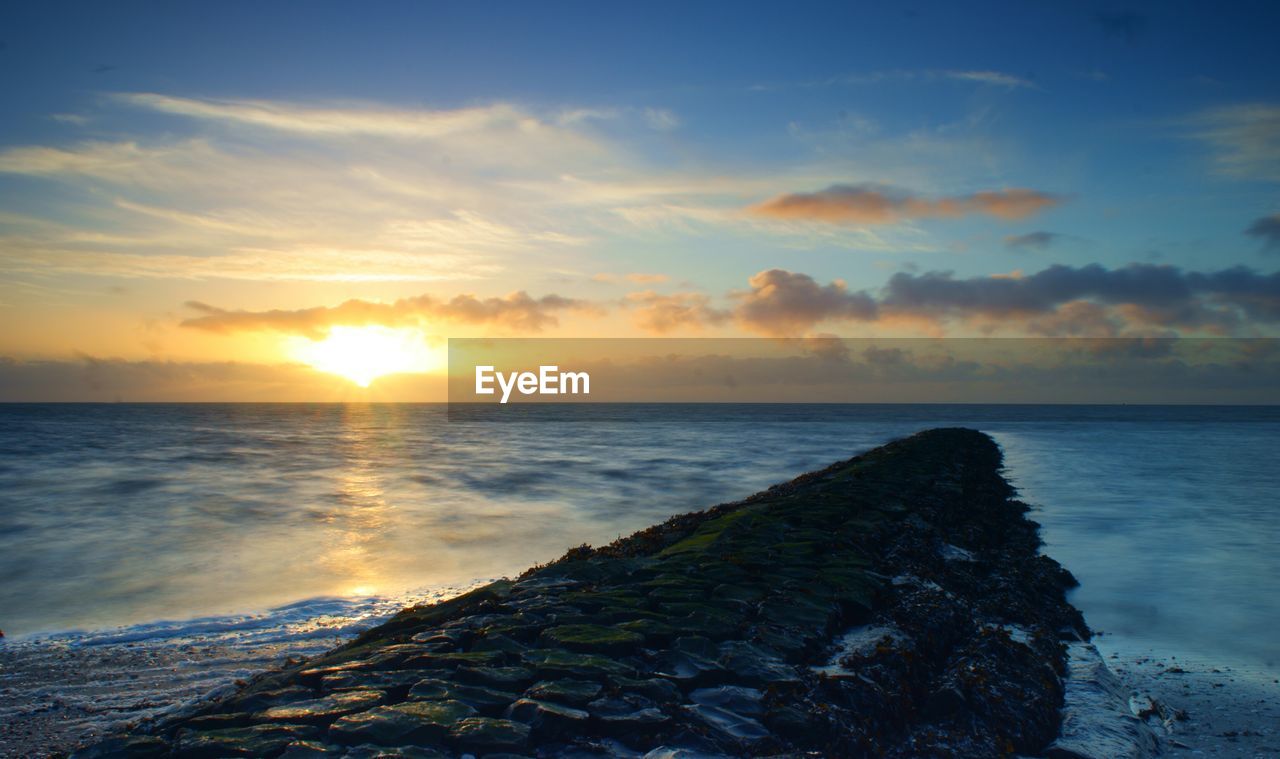 Scenic view of sunset over ocean