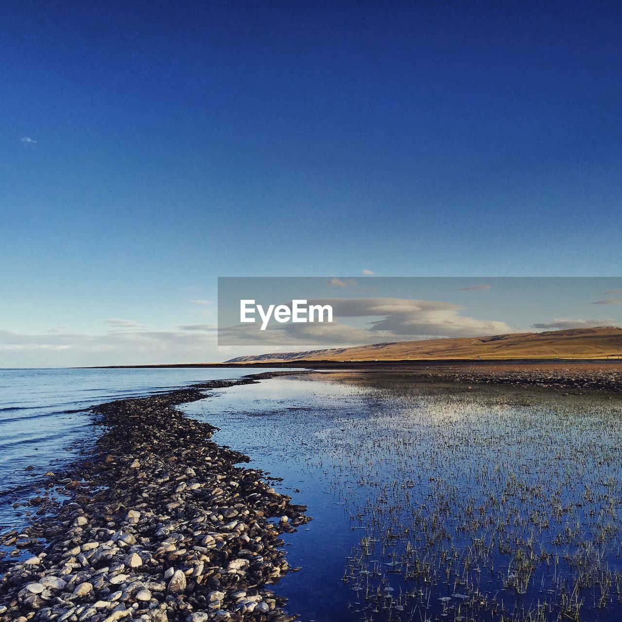 SCENIC VIEW OF CALM SEA AGAINST SKY