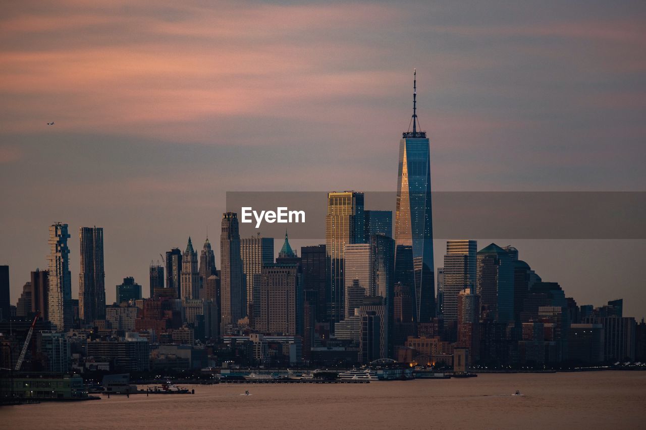 Modern buildings in city at sunset