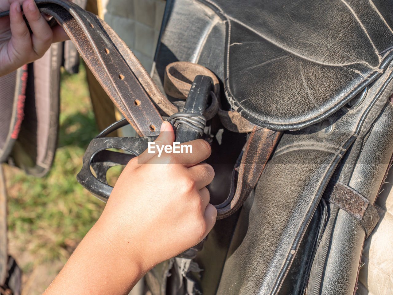 MIDSECTION OF PERSON WORKING WITH HANDS