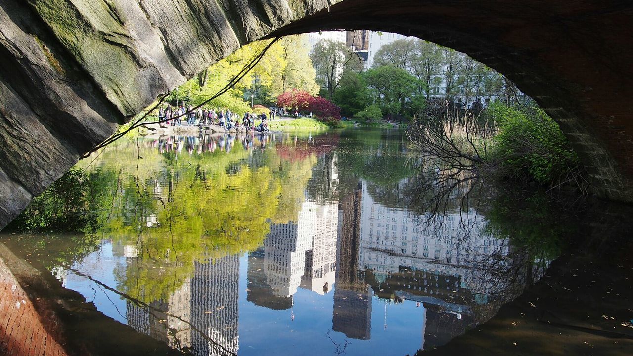 Reflection of buildings on lake at central park