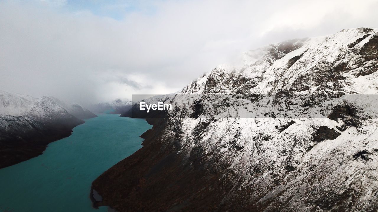 SNOWCAPPED MOUNTAINS AGAINST SKY