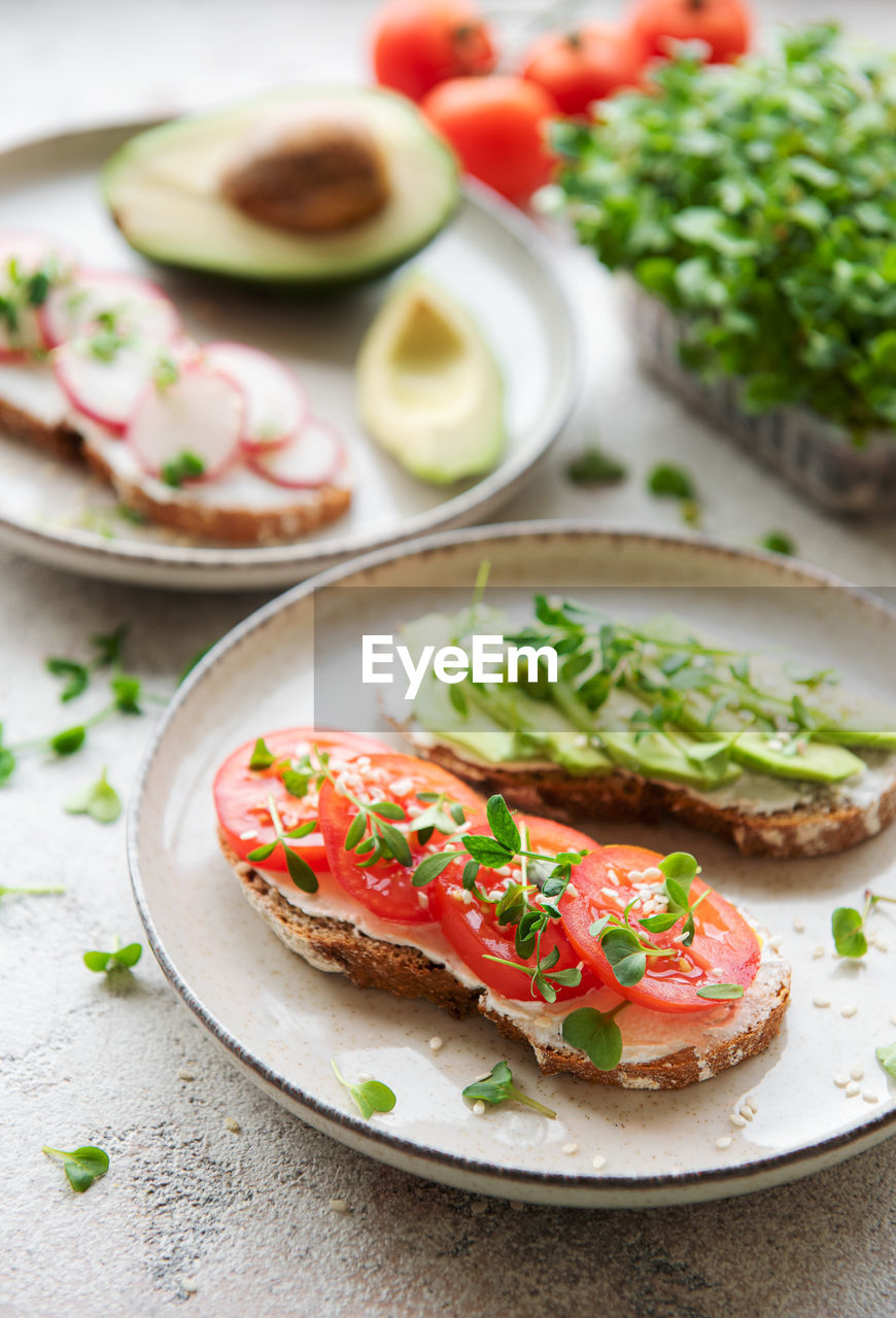 Different sandwiches with vegetables and microgreens. healthy food