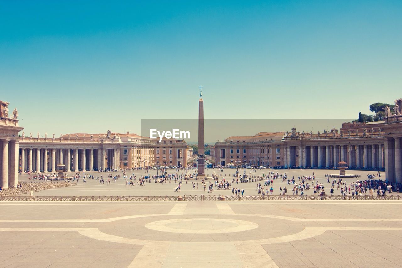 Tourist at st peter square against clear sky