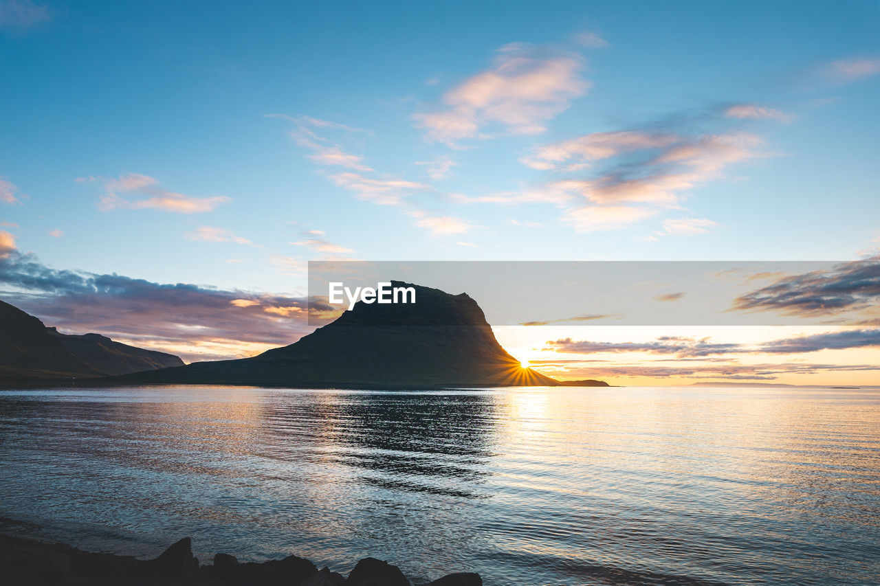 scenic view of sea against clear sky during sunset