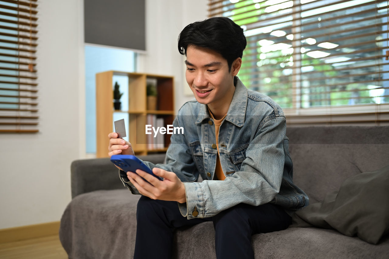 young man using mobile phone