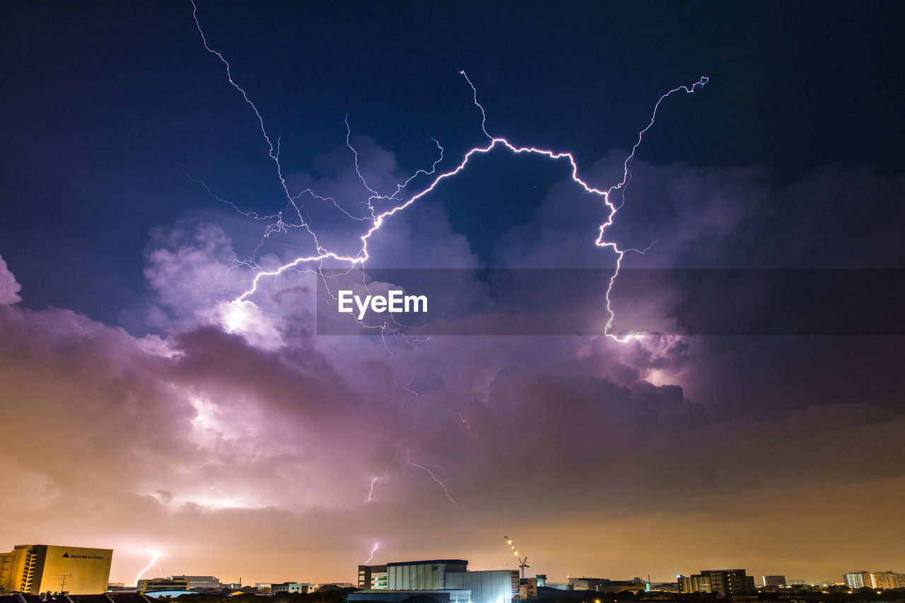 Lightning bolt dancing freely and widely across the late night skies - singapore