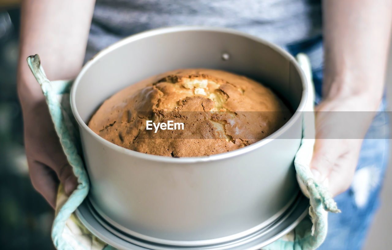 Midsection of woman baking bread