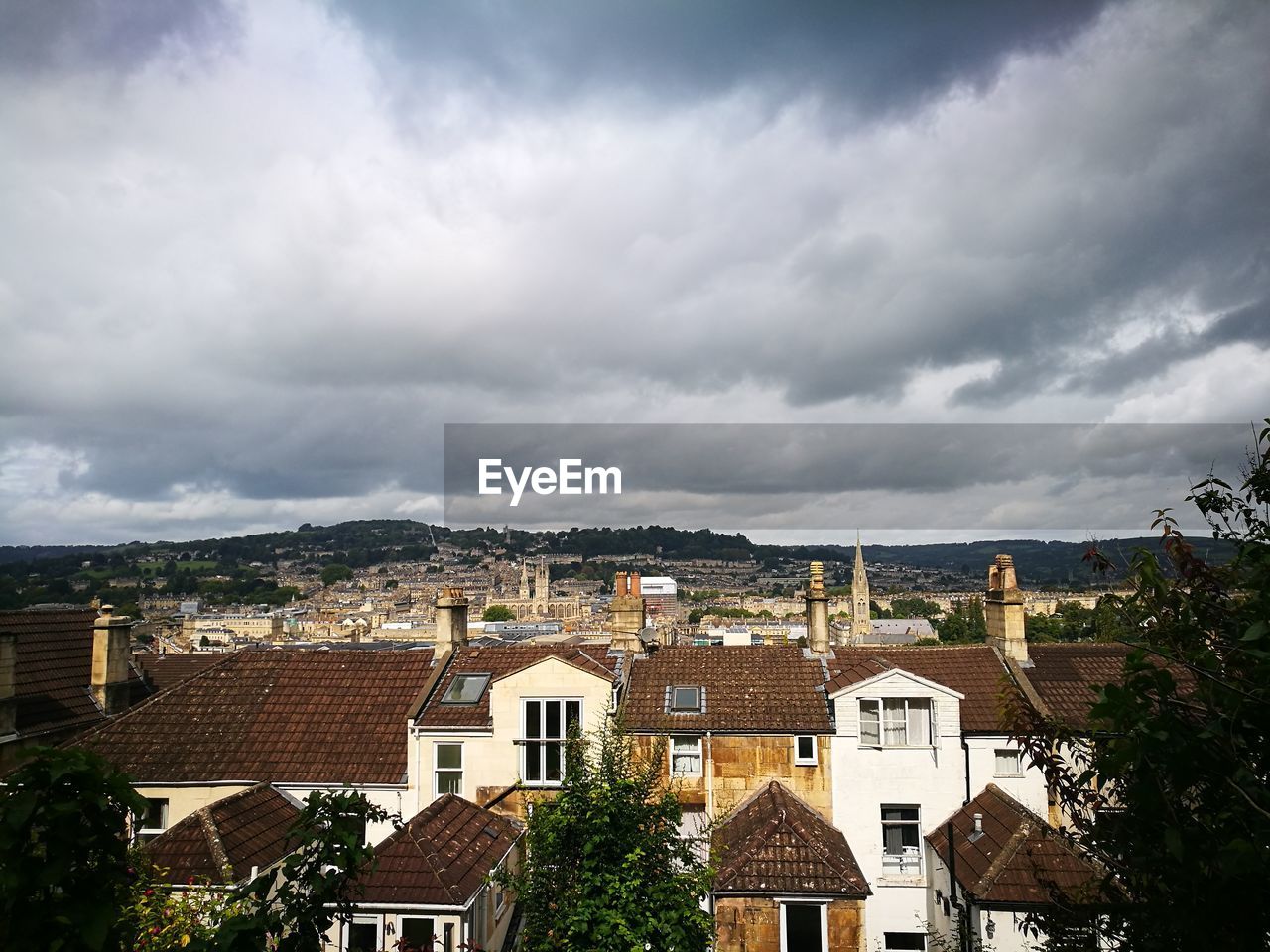 Houses in city against sky