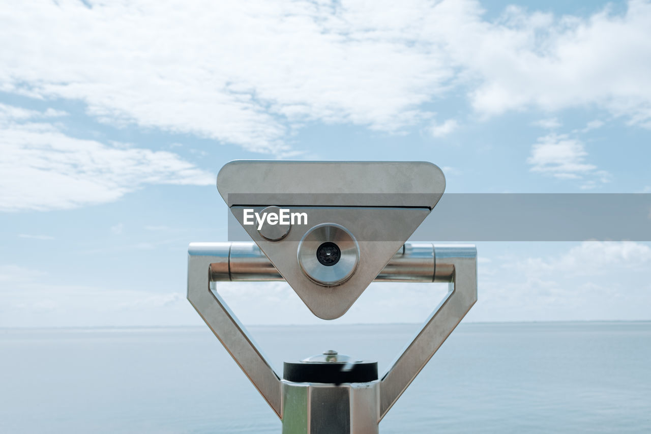 Coin operated binocular viewer next to the waterside promenade