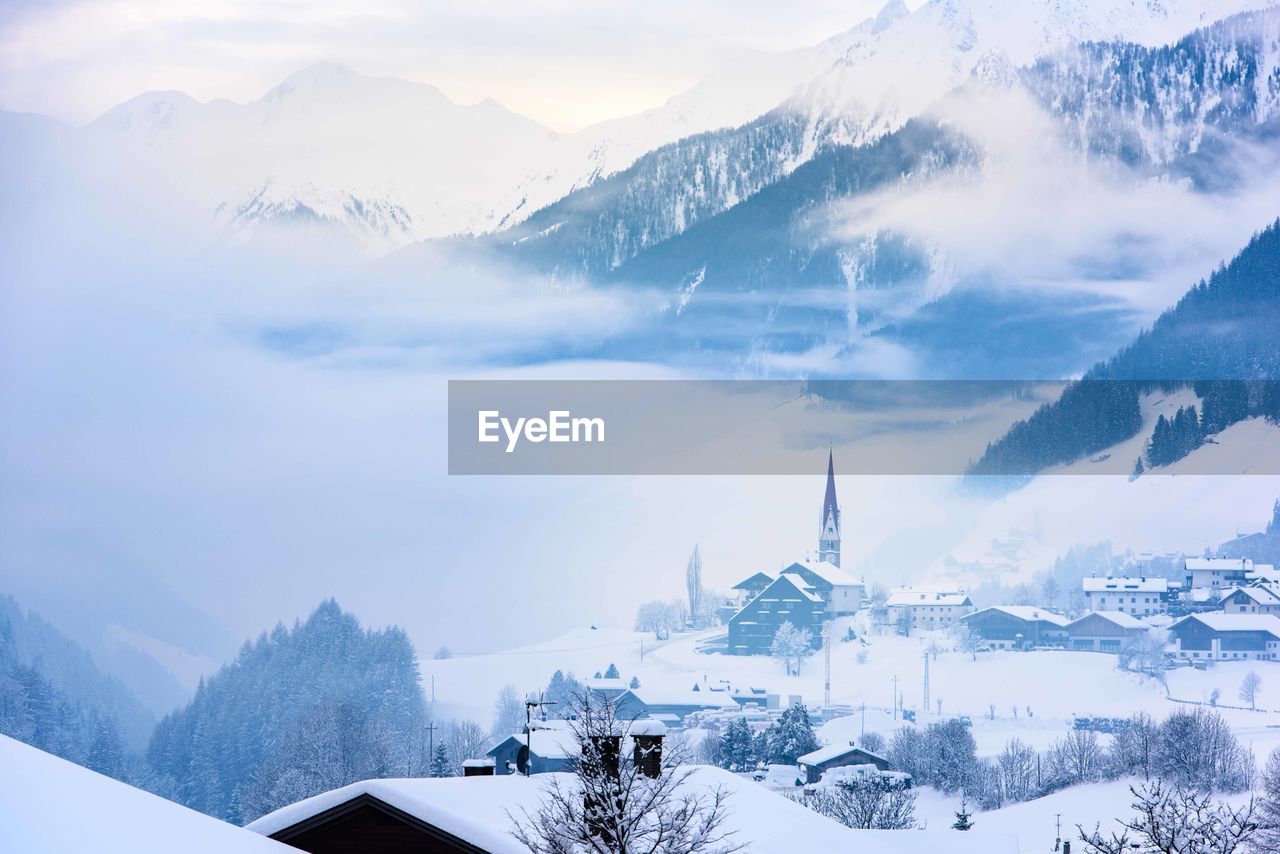 Panoramic view of snowcapped mountains against sky