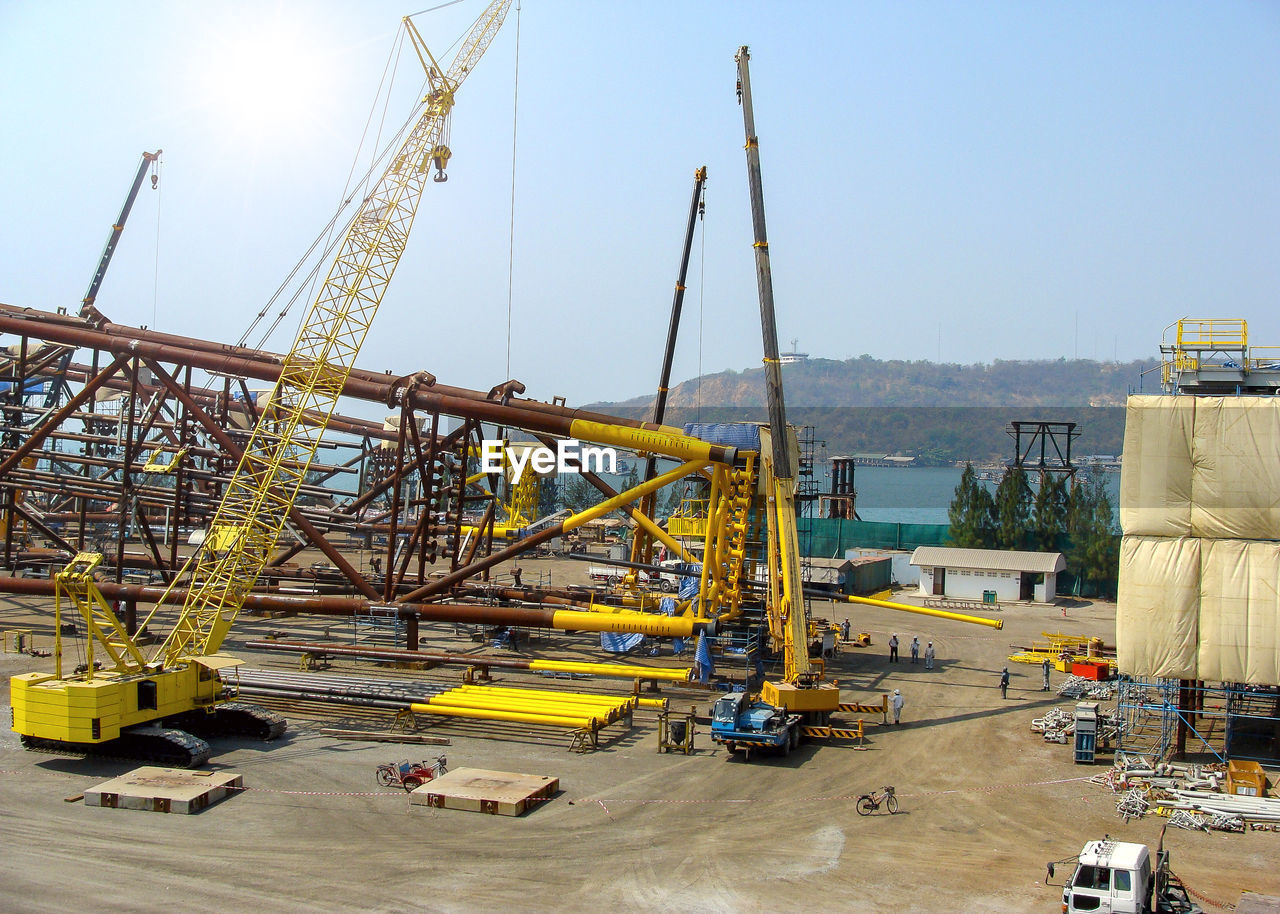 CRANES AT CONSTRUCTION SITE