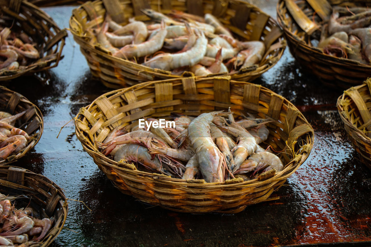 Close-up of seafood in baskets for sale