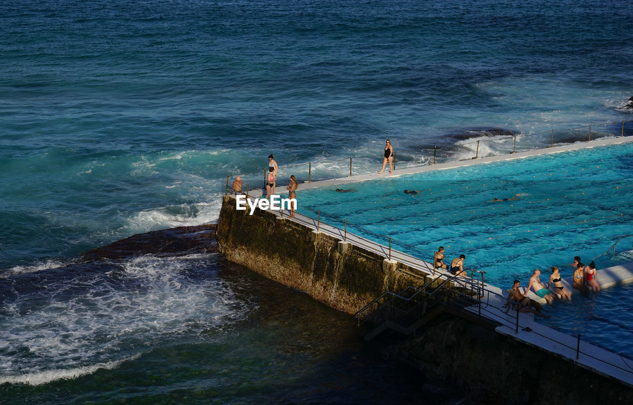 High angle view of people at infinity pool