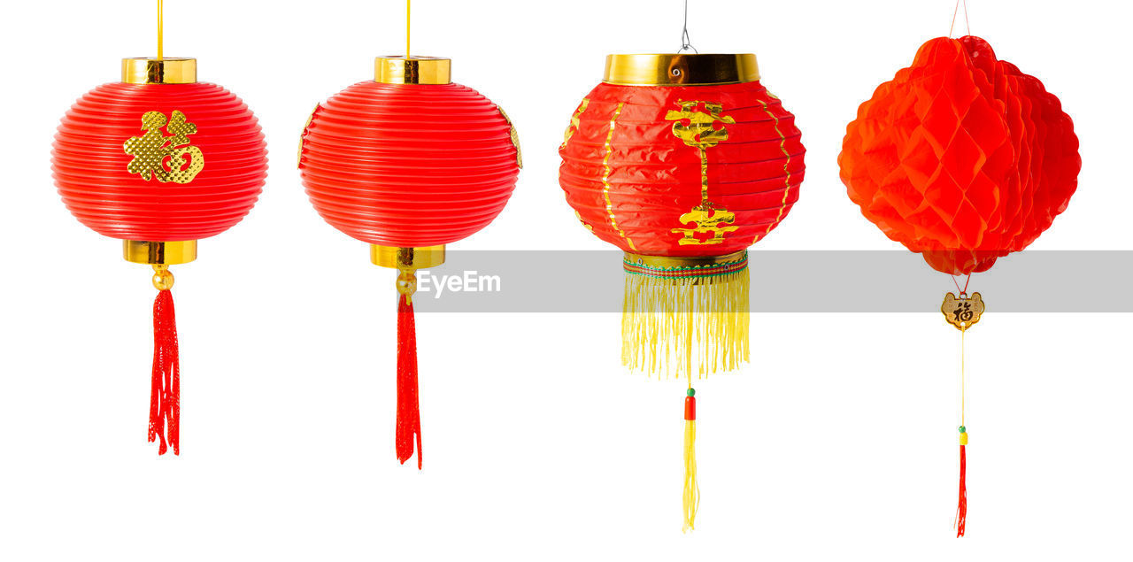 red, hanging, orange, white background, cut out, event, studio shot, celebration, no people, group of objects, multi colored, decoration, lighting, holiday, chinese new year, in a row, festival, earring, indoors, craft, tradition, chinese lantern, lighting equipment, lantern