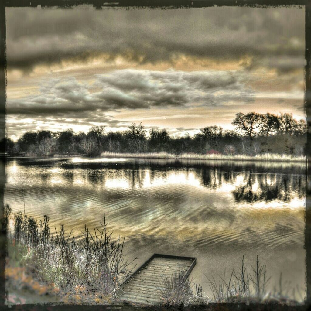 SCENIC VIEW OF LAKE AT SUNSET