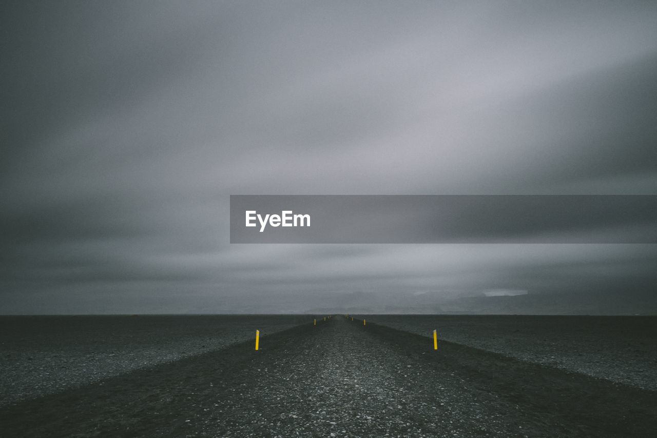 Scenic view of sea against storm clouds